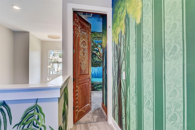 doorway to outside featuring wood-type flooring