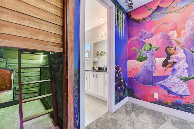 bathroom featuring tile patterned flooring and vanity