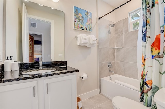 full bathroom featuring tile patterned flooring, vanity, shower / bath combo, and toilet