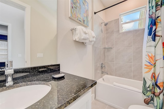 bathroom with tile patterned flooring, vanity, and shower / bath combo with shower curtain