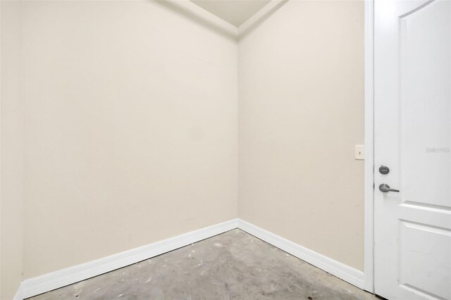 washroom with baseboards