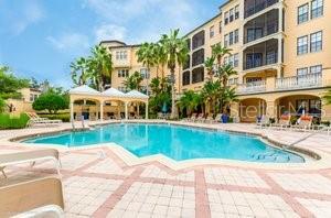 pool with a patio and a gazebo