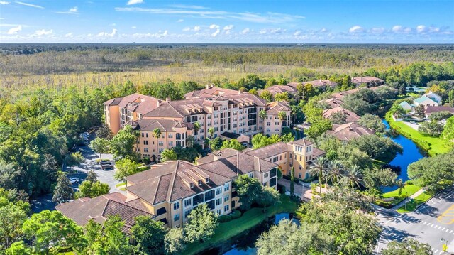 birds eye view of property with a water view and a residential view