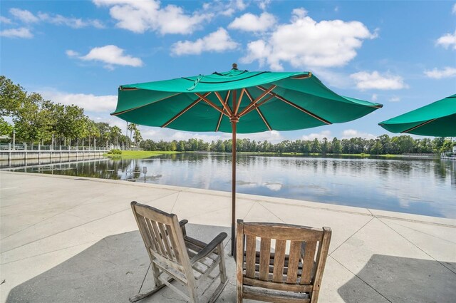 view of patio with a water view