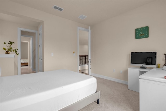 bedroom with light colored carpet