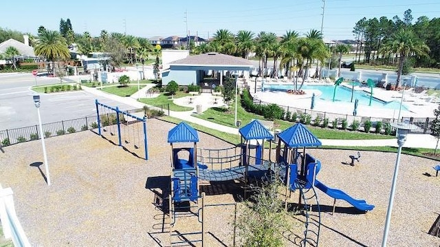 surrounding community featuring a pool and a playground