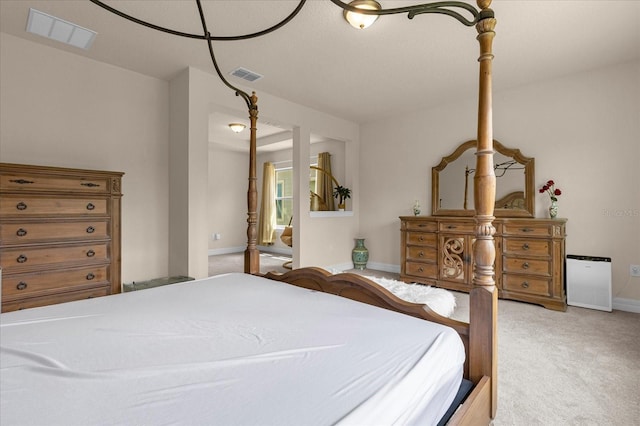 bedroom featuring light colored carpet