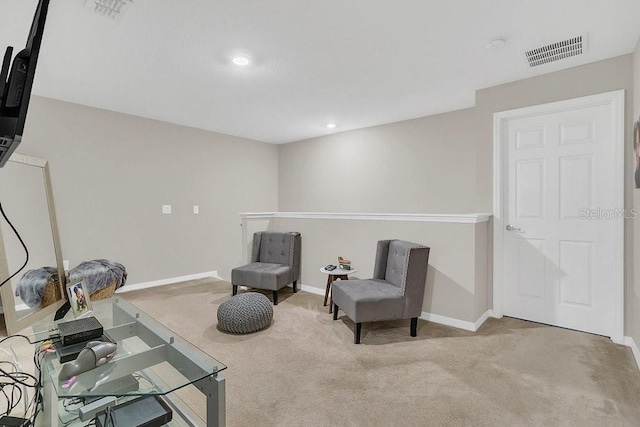 sitting room with light colored carpet