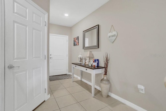 entryway with light tile patterned floors