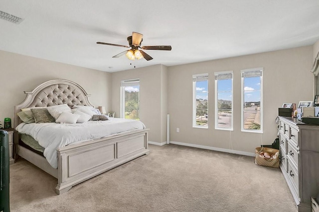 bedroom with light colored carpet and ceiling fan