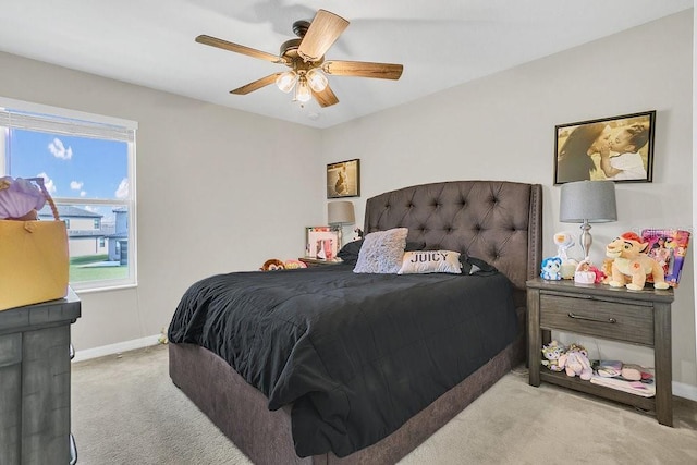 bedroom with light carpet and ceiling fan