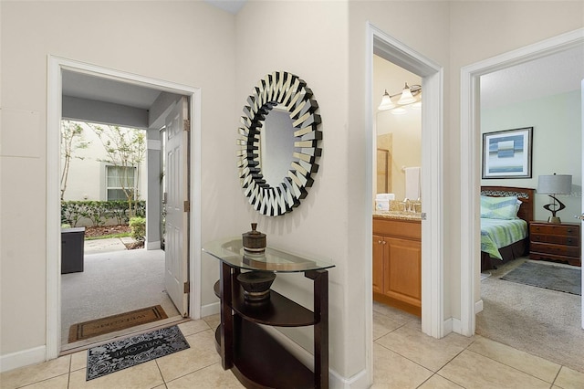 interior space with a healthy amount of sunlight, light carpet, and sink