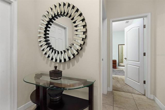 hallway with light tile floors