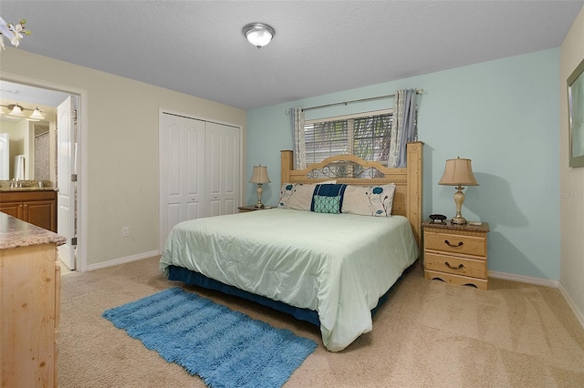 bedroom with a closet and light carpet