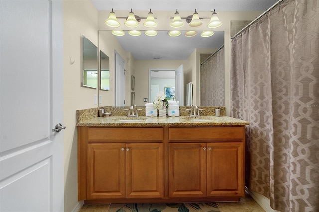 bathroom with tile floors and double sink vanity