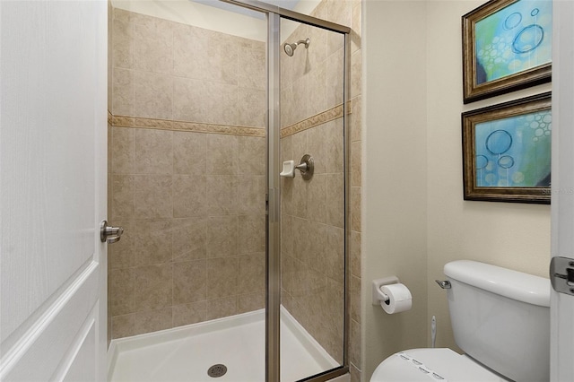 bathroom with walk in shower and toilet