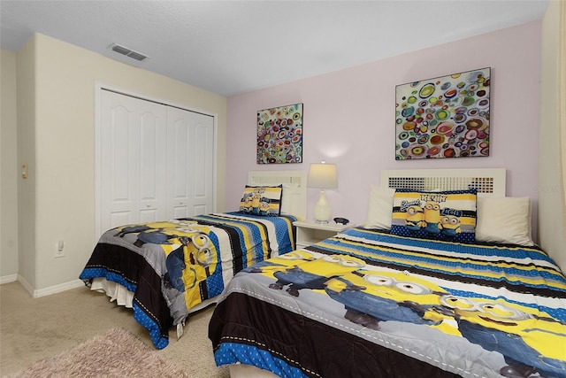 carpeted bedroom featuring a closet