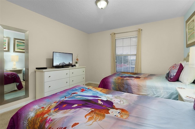 carpeted bedroom with a textured ceiling