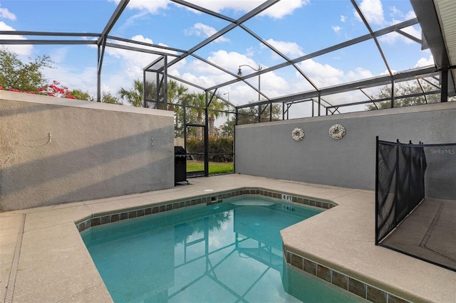 view of swimming pool with a lanai