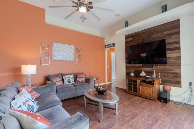 living room with dark hardwood / wood-style floors and ceiling fan