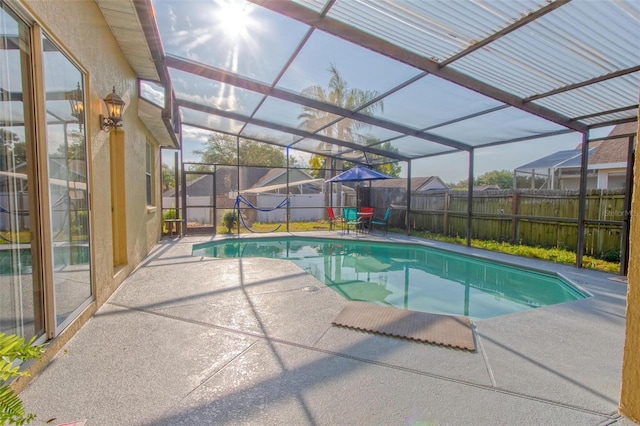 view of pool featuring a lanai and a patio area