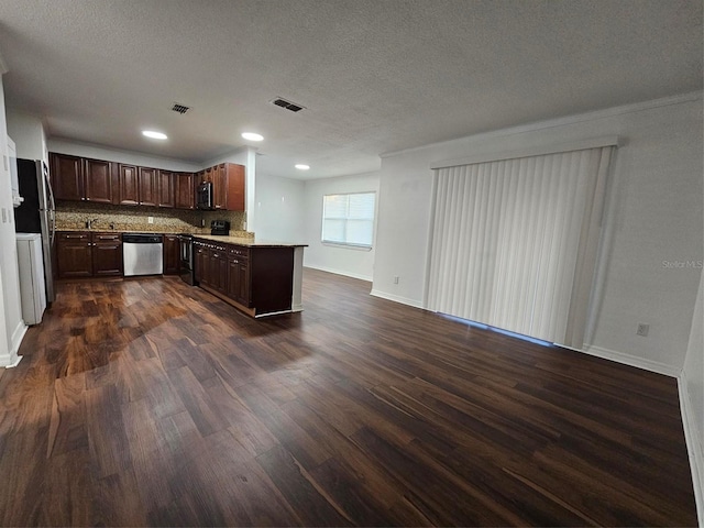 kitchen featuring dark brown cabinetry, tasteful backsplash, dark hardwood / wood-style flooring, a textured ceiling, and appliances with stainless steel finishes