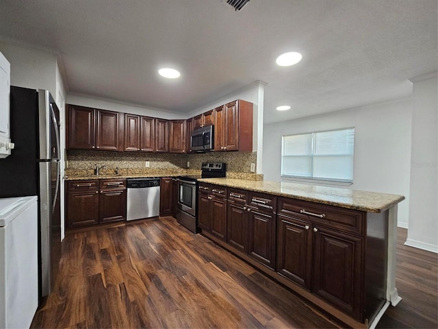 kitchen featuring kitchen peninsula, decorative backsplash, dark wood-type flooring, and stainless steel appliances