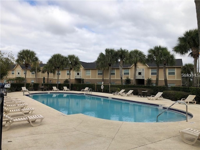 view of swimming pool with a patio area