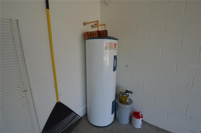 utility room featuring water heater