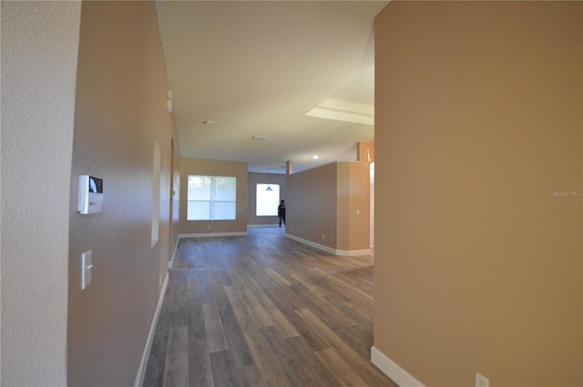 corridor featuring dark hardwood / wood-style floors