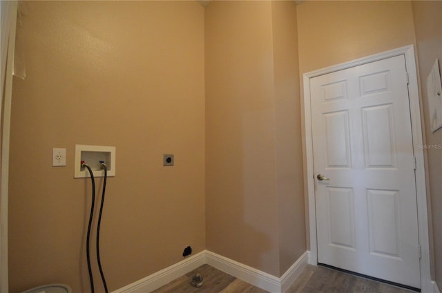 washroom featuring hookup for a washing machine, dark hardwood / wood-style floors, and electric dryer hookup