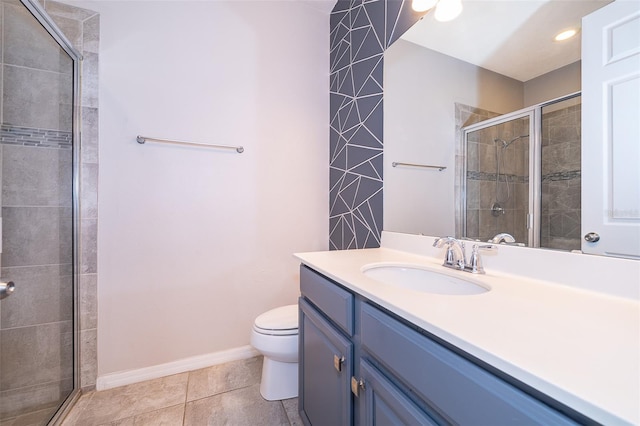 bathroom with walk in shower, vanity with extensive cabinet space, toilet, and tile floors