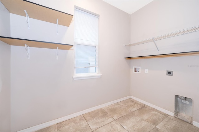 laundry area featuring washer hookup, light tile floors, and electric dryer hookup