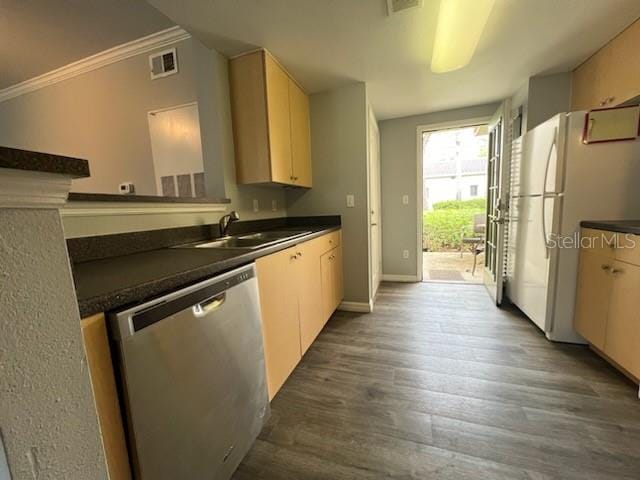 kitchen with wood-type flooring, white refrigerator, crown molding, sink, and stainless steel dishwasher