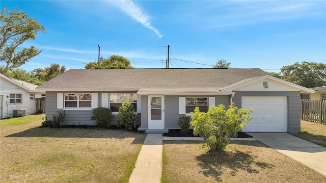 single story home with central AC unit, a garage, and a front yard