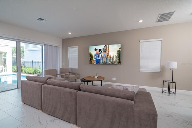 living room featuring light tile flooring