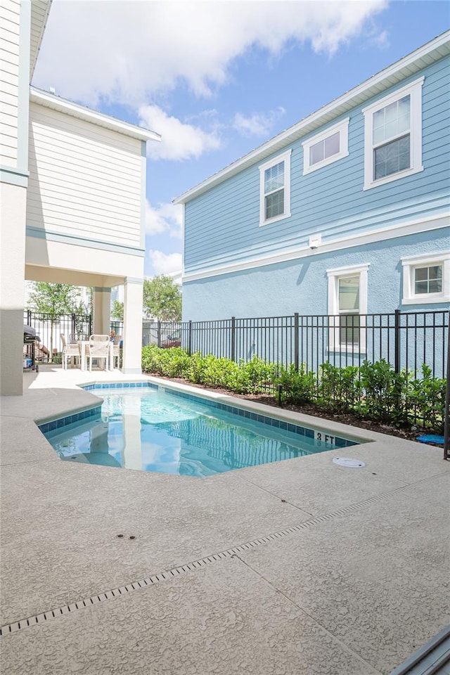 view of pool featuring a patio