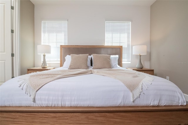 bedroom featuring multiple windows