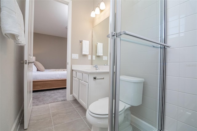 bathroom featuring tile flooring, oversized vanity, an enclosed shower, and toilet