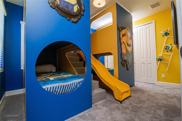 bedroom with a closet and carpet floors