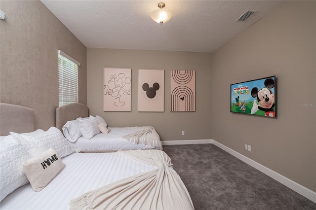 carpeted bedroom with a textured ceiling