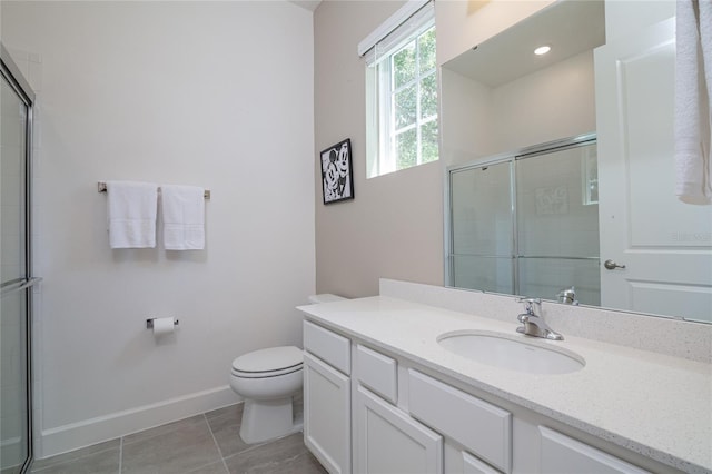 bathroom with an enclosed shower, vanity, toilet, and tile flooring