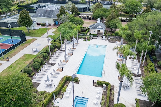 view of swimming pool featuring a patio area and a lawn