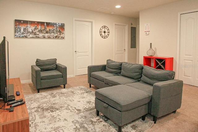 living room with electric panel and carpet floors