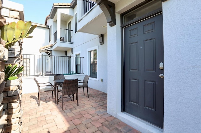 doorway to property featuring a balcony