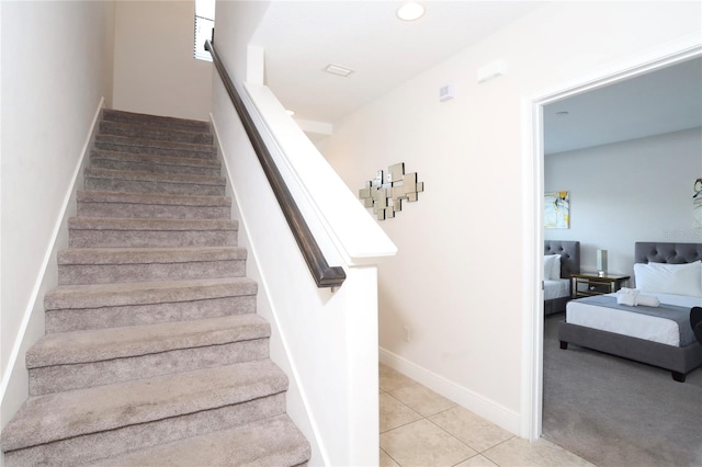 stairway with light tile flooring