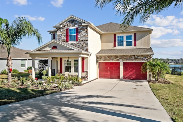 view of front facade featuring a garage and a front lawn