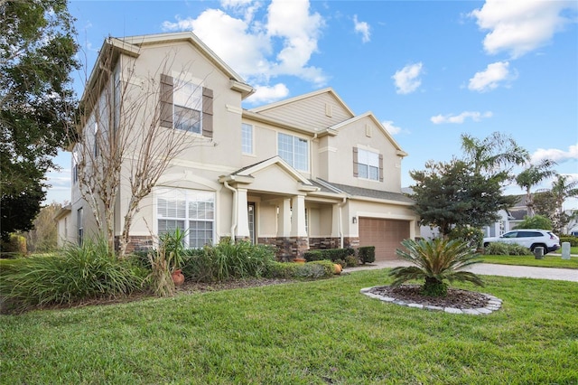 view of front of property with a front lawn and a garage