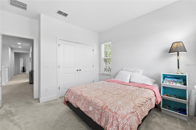 carpeted bedroom with a closet