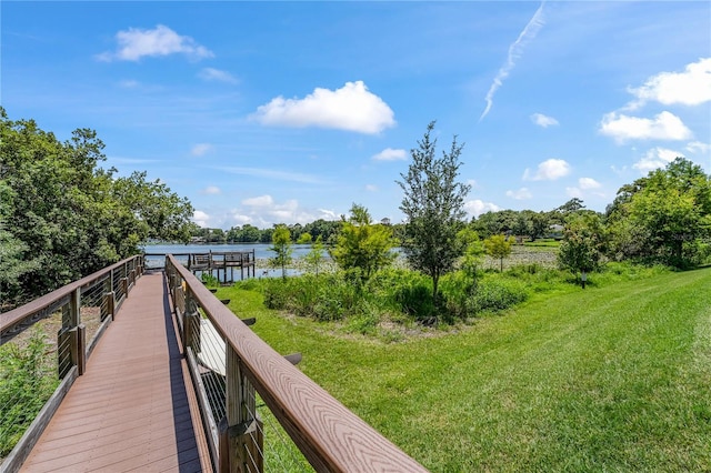 exterior space with a lawn and a water view